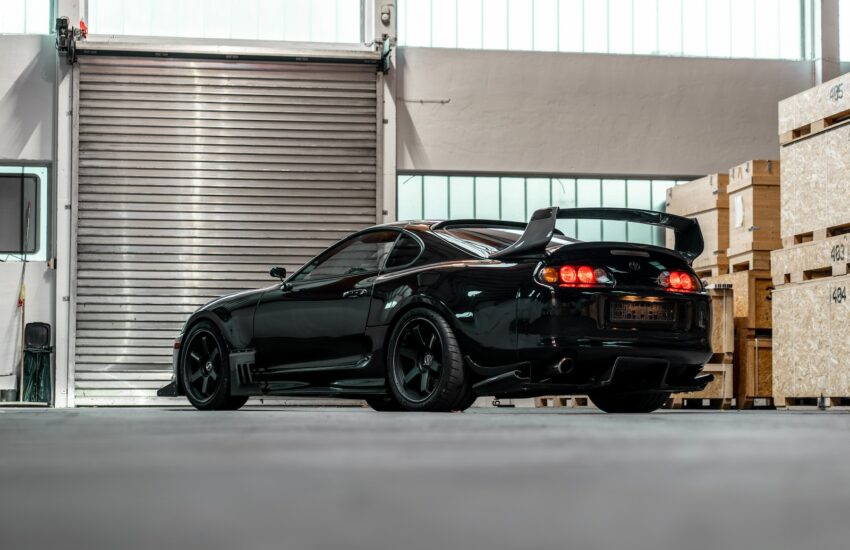 black porsche 911 parked in garage