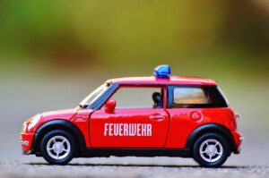 fire fighters, mini cooper, automobile, model car, red, blue light, vehicle, toy, toy car, toy, toy, toy, toy car, toy car, toy car, toy car, toy car